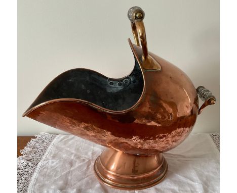 A 19thC copper coal helmet with glass handles. 50 x 28cm. 