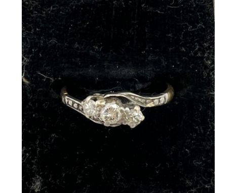 An 18 carat three stone diamond ring, size K, weight 1.8gm. 