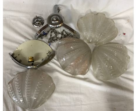 A retro vintage early 20th Century Art Deco ceiling light lamp fixture comprising of three clam shell glass shades surroundin
