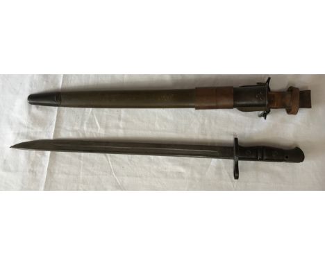 A 1918 dated Remington bayonet with scabbard and frog attachment. 