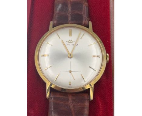 A boxed Movado 9ct gold cased manual wristwatch, subsidiary seconds dial, engraved to back case To Mr. K. Freeman From The Di