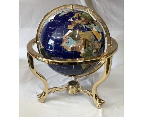 A large Globe in minerals and semi - precious stones with built in compass base 48cm h. 