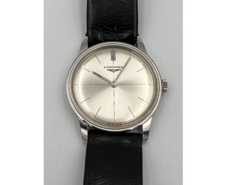 A 1970's Longines manual wristwatch with silver face and leather strap.Winds and goes. Very good condition. Purchase receipt 