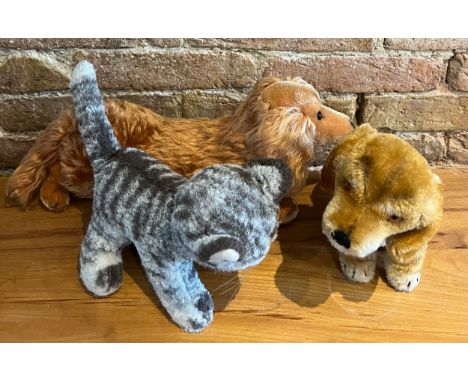 Three Steiff soft toys, two dogs and a cat, two with buttons, all with labels. 