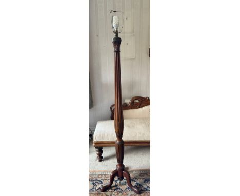 A mahogany standard lamp on tripod base with reeded and wheatsheaf decoration. 173cm h to top of fitting. 
