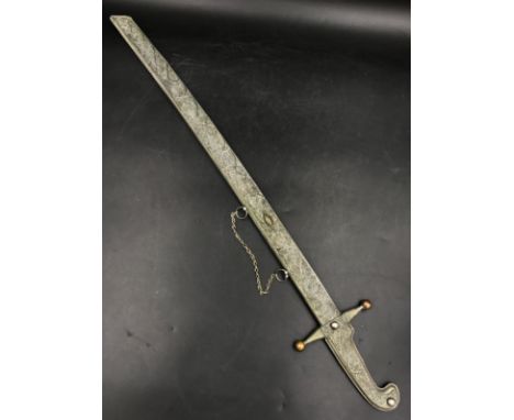 A white metal Russian dress sword and scabbard with engraved writing to reverse 74 l, blade 55cm l. 