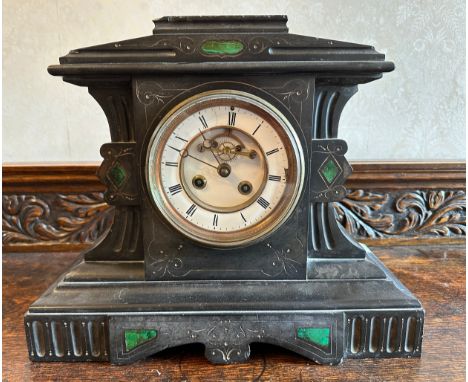 A 19thC black marble mantle clock with green marble pillars to both sides of white enamel face. 32 h x 37 w x 14cm d. 
