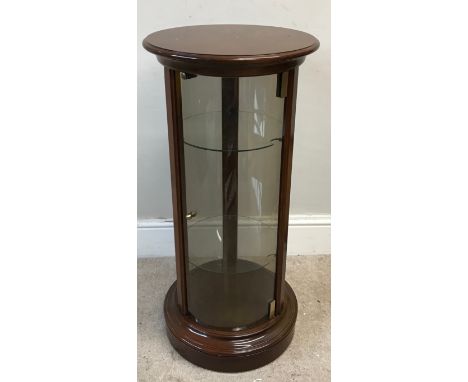 A reproduction mahogany drum design display cabinet, all round glazed panels with single door and two glass shelves,  89cm h 