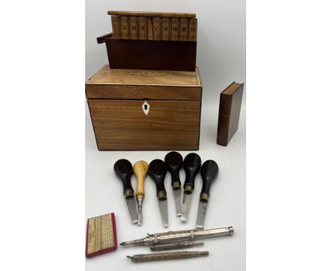 A miscellany to include a Georgian tea caddy, inlaid puzzle box, Purdey wooden box containing playing cards, propelling penci