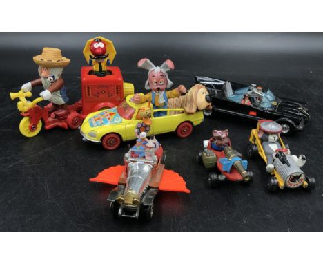 A collection of vintage children's toy cars from film and TV to include Corgi Toys The magic roundabout Mr McHenry's Trike wi