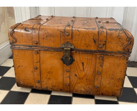 A vintage metal travel trunk with side handles. 71 w x 48 h x 47cm d. Plaque to interior 'Patent Combination Block No 2724'. 