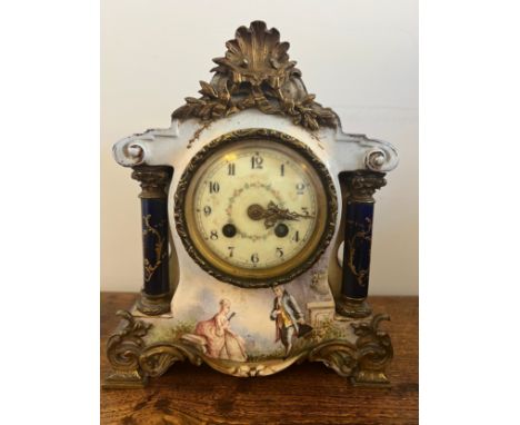 A French painted porcelain mantle clock with white enamel and floral decorated face. 27cm h. 