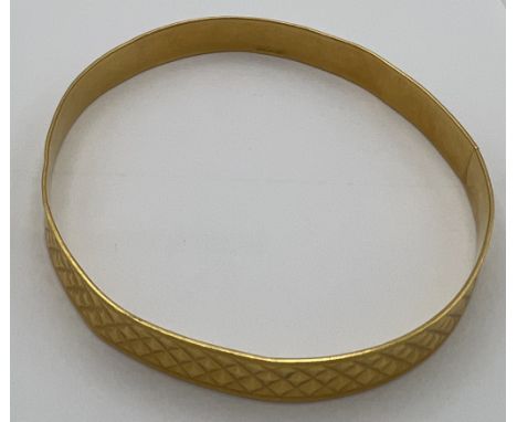A 21 carat gold bangle marked 875. Weight 20.3gm.