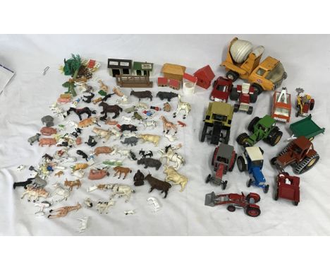 A collection of toys to include four Tonka vehicles to include a cement mixer, tractor, tow truck and car along with toy trac