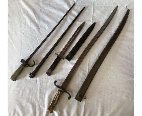 Three Bayonets to include a French Model 1867 Chassepot Yataghan Sword Bayonet and Scabbard, brass handle, muzzle ring/quillo