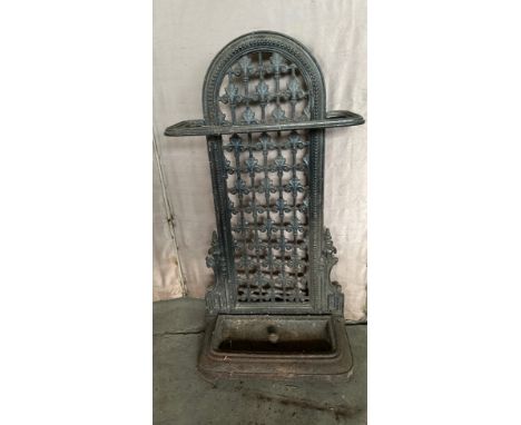 A Victorian cast iron stick stand with removable drip tray. registration lozenge to rear, together with two shooting sticks a