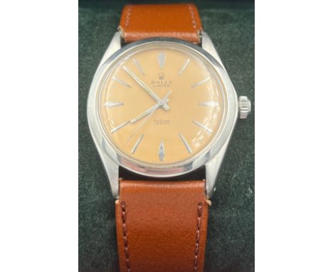 A boxed 1950's Rolex Oyster Tudor manual gentleman's wristwatch on brown leather strap, stainless steel case and cream face. 