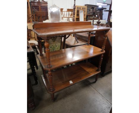 A walnut three tier buffet 