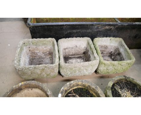 Three concrete garden planters