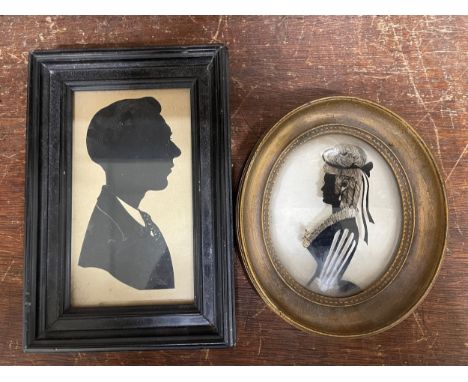 A silhouette on glass, portrait of a lady and one other 