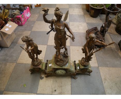 A 19th Century French onyc clock garniture