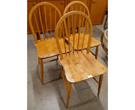 A set of three Ercol Blonde elm and beech Windsor chairs 