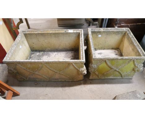 Two concrete lions head garden planters 