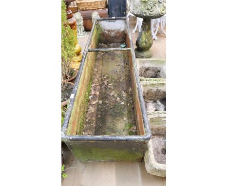 A large galvanised trough 