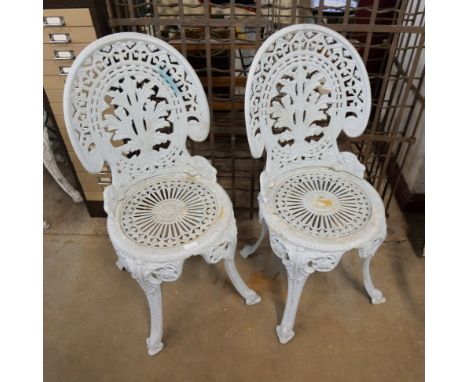 A pair of cast garden chairs 
