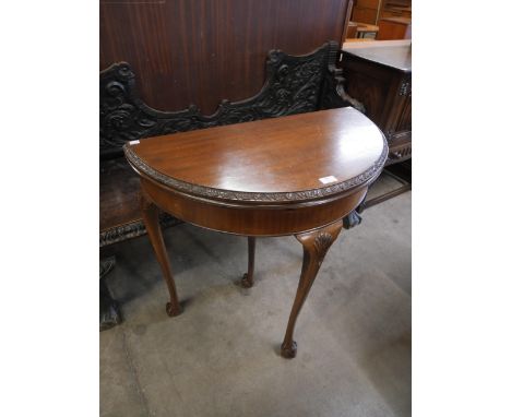 A Queen Anne style mahogany demi lune card table