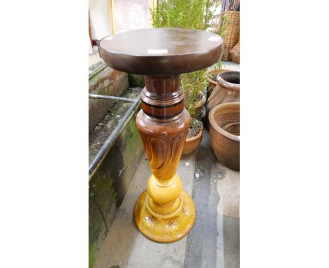 A ceramic jardiniere stand 