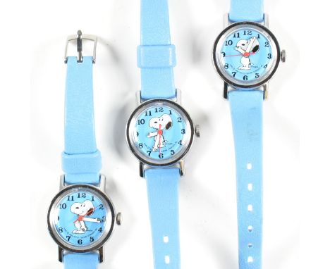 Three Timex Snoopy wrist watches. The watches having Arabic indices with a depiction of Snoopy with his arms doubling as the 