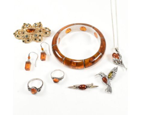 A collection of silver and amber jewellery. The jewellery to include a silver and amber bangle, marked 925. Two silver and am