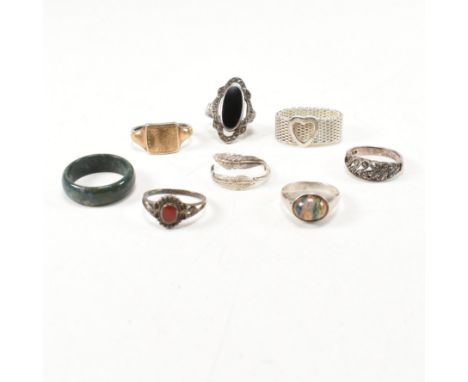 A collection of silver and gem set rings. The eight rings to include a silver mesh ring with heart detail, marked 925. A bloo