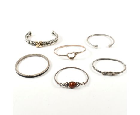 A collection of silver bangles and bracelets. The lot to include six silver and gem set bangles and bracelets. Two 925 silver