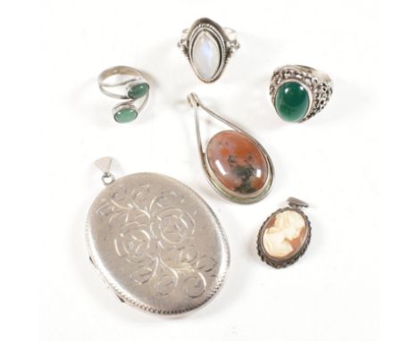 A collection of 925 silver and gem set jewellery. The lot to include a hallmarked engraved locket pendant, hallmarked for Lon