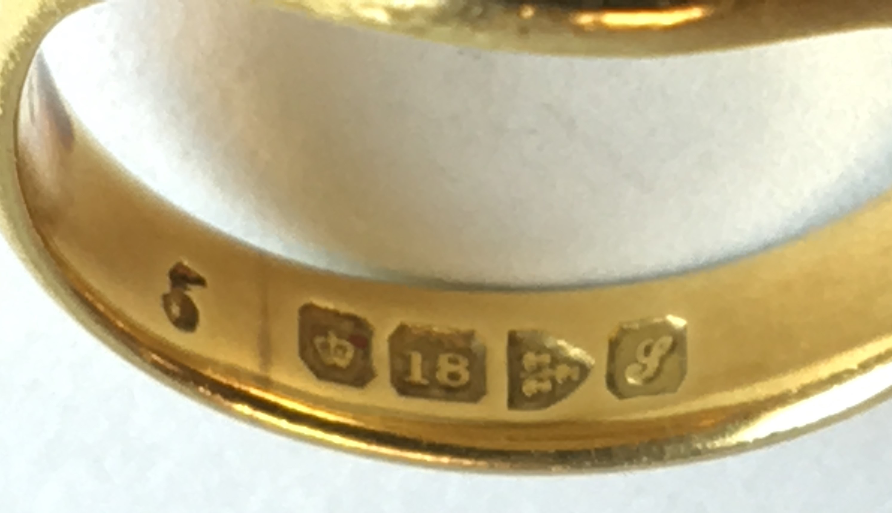 18 carat gold ring engraved with