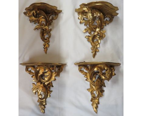 Four gilt wood wall shelf bracket carved with acanthus leaves, dimensions of shelf width 26cm, depth 14.5cm, overall height 2