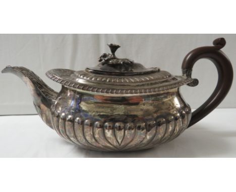 George III silver teapot with half reeded body, foliate moulded knop, and a replacement plastic handle, marks for London, 181