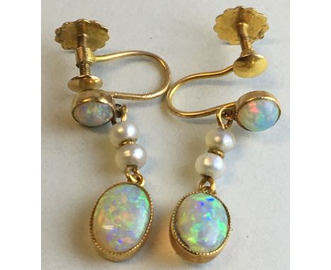 Pair of 9 carat gold pendant opal and seed pearl earrings, each with a circular opal (about 4mm) and an oval opal (about 7mm 