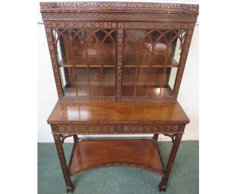 Edwards &amp; Roberts Chippendale style glazed cabinet on stand, the two-door cabinet with Gothic tracery enclosing a single 