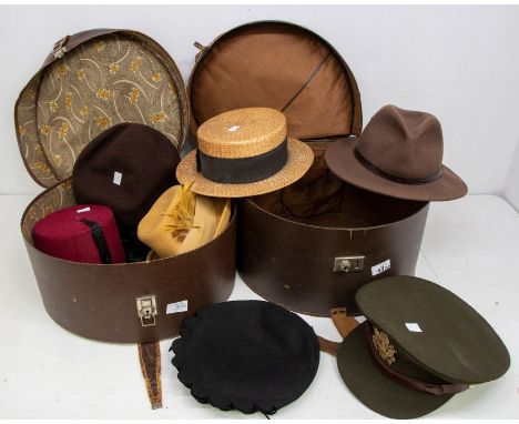 A collection of hats to include two black 1940's dark green velvet with brooch, one brown felt, one mustard coloured, late 19