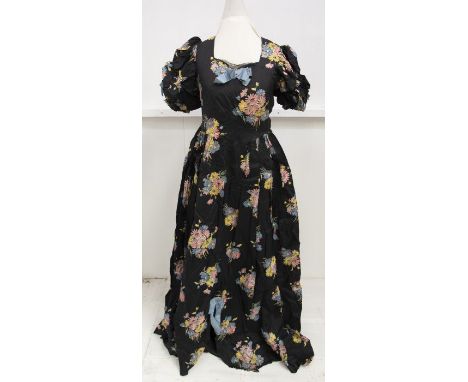 A first half early 20th Century black full length dress with colourful summer flower pattern