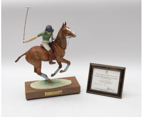 A large Royal Worcester figure in original carry box and framed certificate of HRH Prince Charles on Pans Folly, playing polo