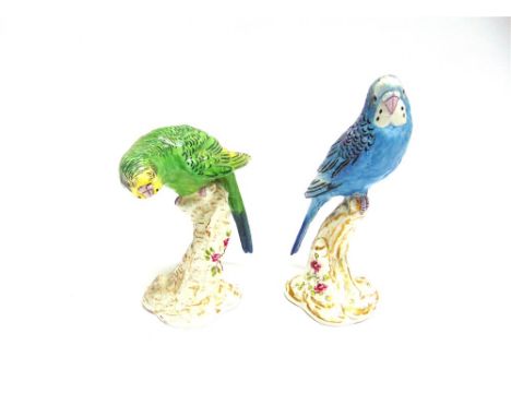 A PAIR OF ROYAL WORCESTER FIGURES OF BUDGERIGARS,  numbers 2663 and 2664, enamelled in light blue and green respectively, on 