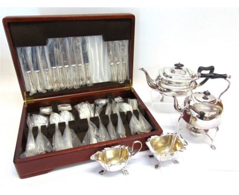 A PLATED CANTEEN OF CUTLERY with a plated kettle on stand with burner; a plated cream jug and sugar basin; and a plated prese