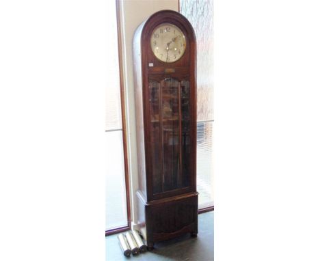 A 1930s LONGCASE CLOCK with chiming movement, contained in an arched case with presentation plaque dated 1930, 196cm high, 52