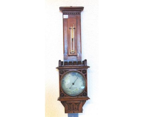 A VICTORIAN BAROMETER/THERMOMETER the dial signed 'Negrretti & Zambra, London 7122', and contained in a carved oak case, 74cm