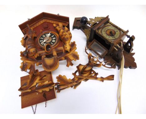 A CONTINENTAL BRASS MOUNTED WALL CLOCK  and a contemporary cuckoo clock (2)