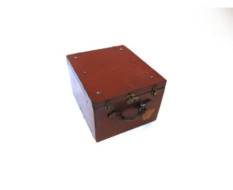 A LEATHER TRAVELLING TRUNK  with a red leather lined interior, and the remains of an L.N.E.R. luggage label, 34cm high, 43cm 